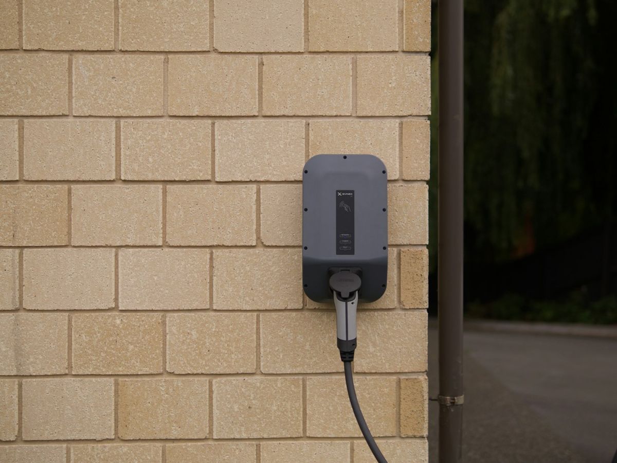 EV charger on a brick wall